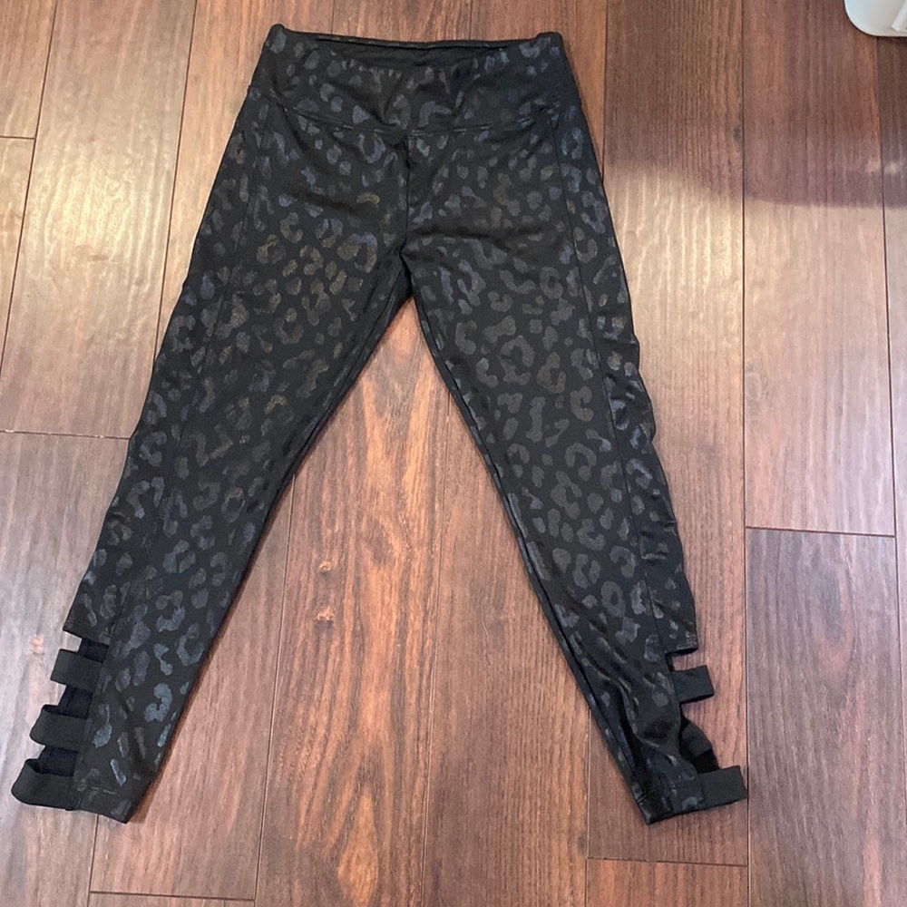 Gently used girls Justice active wear leggings size 12. Black animal print.